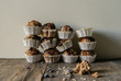 © ADDICTIVE STOCK - Freshly baked muffins stack on table against wall