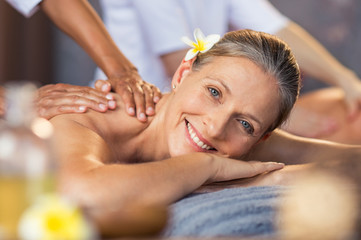 Wall Mural - woman getting oil massage at spa