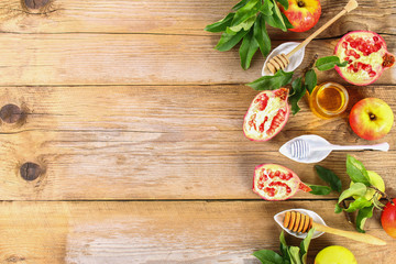 Rosh hashanah jewish New Year holiday concept. Traditional symbol. Apples, honey, pomegranate. Copy space. Top view. Flat lay.