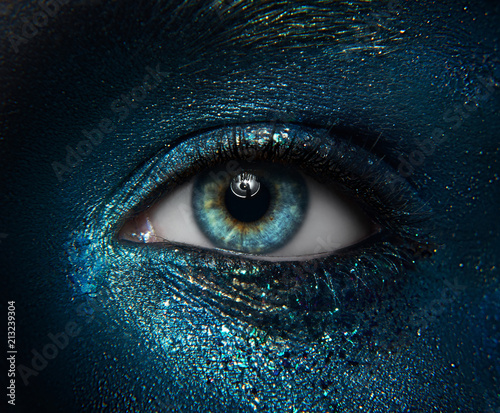 Macro and close-up creative make-up theme: beautiful female eyes with black skin Fototapet