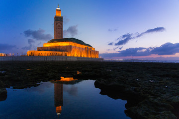 view of Hassan II mosque reflected on water - Casablanca - Morocco