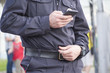man police with smartphones on the street