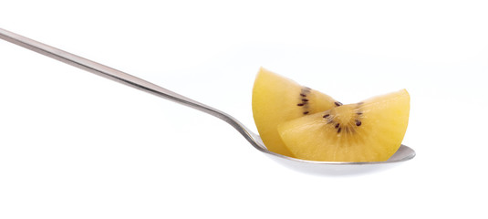 Wall Mural - stainless spoon of slice gold kiwi isolated on white background