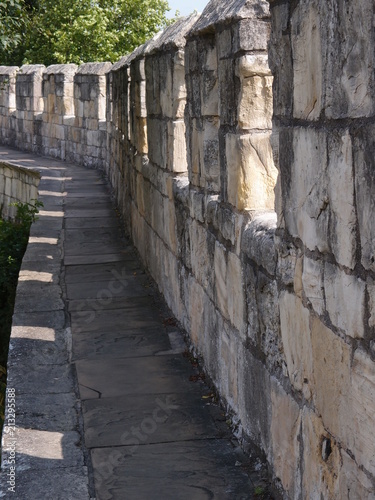 Fotografija The historic fortified York Wall made of carved stone