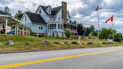 Surrey, British Columbia, Canada. 06. 26. 2018. View of Smugglers Inn B&B located in Washington, United States, picture was taken from Canada, from 0 Ave.