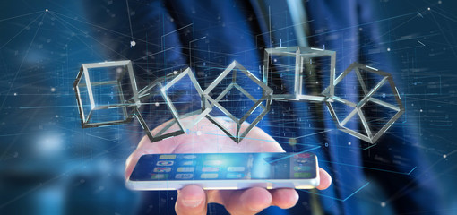 Poster - Businessman holding a 3d rendering blockchain cube isolated on a background