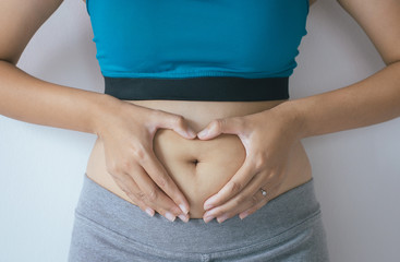 Wall Mural - Woman excess belly fat and overweight fatty bellys of female