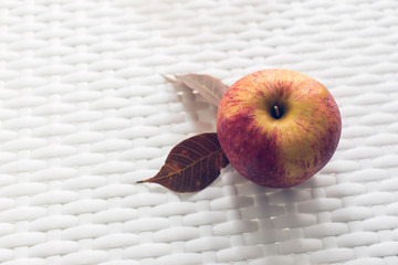 Apple on the white table. Vintage