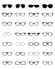 Black silhouettes of different eyeglasses on a white background