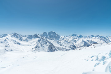 Winter snow covered mountain peaks in Caucasus. Great place for winter sports