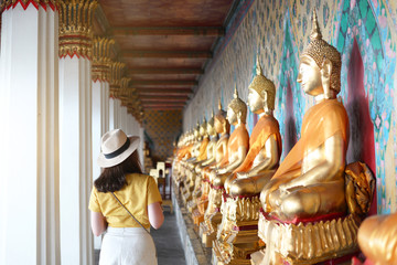 Wall Mural - Tourist is visiting and sightseeing inside the Wat Arun temple in Bangkok, Thailand during holiday summer vacation time.