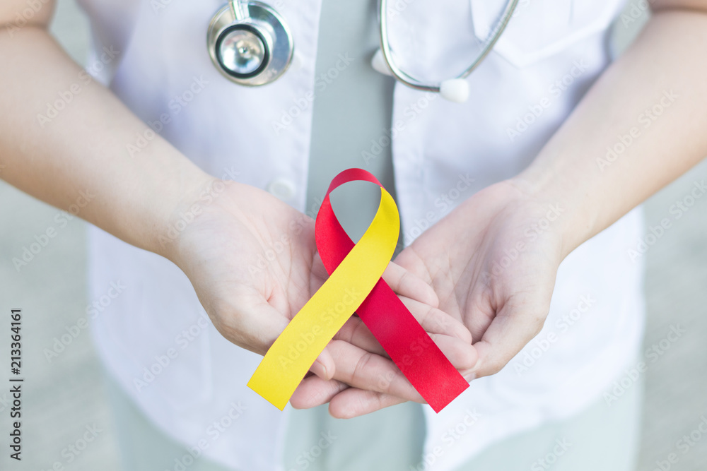Red and Yellow awareness ribbon for Hepatitis C, HIV/HCV Co-Infection and Surviving family members of Suicide victims.World hepatitis day - obrazy, fototapety, plakaty 