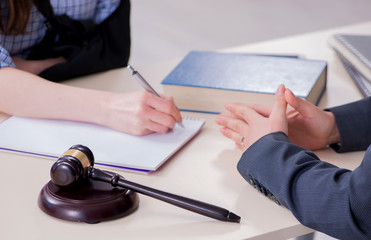 Injured employee visiting lawyer for advice on insurance