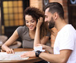 © ASDF - Portrait of a  happy couple sitting down at a cafe