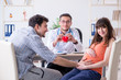 © Elnur - Pregnant woman with her husband visiting the doctor in clinic