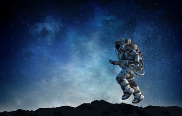 Wall Mural - spaceman running fast. mixed media