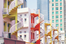 Colorful Spiral Staircases At The Back Of Traditional Chinese Shop Houses In Bugis Village, Singapore. Colorful Urban And Cityscape Concept