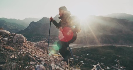 young mountaineer hiking up a mountain. adventurer climbing up. adventures, zen concept 4k