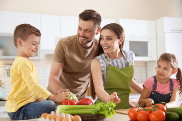 Canvas Print - Happy family with children together in kitchen