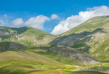 Fototapeta  - Castelluccio di Norcia, 2018 (Umbria, Italy) - The famous landscape flowering with many colors, in the highland of Sibillini Mountains, central Italy