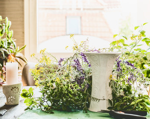 Wall Mural - Home scene for making a summer bouquet for a living room with wild flowers and a vase on the table