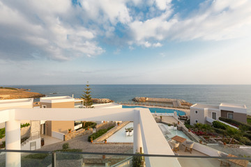 Wall Mural - Outdoor hotel swimming pool with sunbeds around