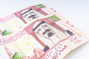 One Hundred Saudi Riyal close up with selective focus and crop fragment