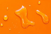 Drops Of Water On A Orange Surface