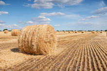 A Stack Of Hay On The Summer Field. Agricultural Landscape At The Summer Time During Harvesting