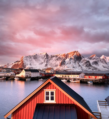 Wall Mural - houses in the lofoten islands bay during sunrise. natural landscape during sunrise in the norway