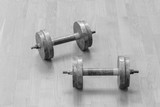 Two iron dumbbells on the floor. the concept of a healthy lifestyle and sport.