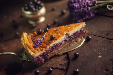 Wall Mural - blueberries and lavander cheesecake served on oven with berries and flowers, still life for patisserie, healthy cake