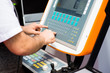 © Marko Rupena - Man working on a keyboard of a console for controlling an industrial machine. Man's hands on a control panel