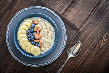 Wall Mural - Bowl of oatmeal porridge