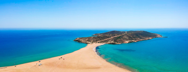 Wall Mural - Aerial birds eye view drone photo Prasonisi on Rhodes island, Dodecanese, Greece. Panorama with nice lagoon, sand beach and clear blue water. Famous tourist destination in South Europe