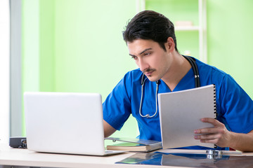 Young doctor working in the hospital