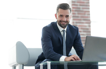 Close-up of a businessman working on a laptop