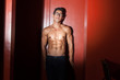 © Attila - Sexy nerdy guy leaning against wall