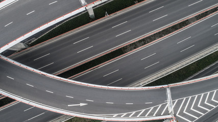 Sticker - Aerial view of highway and overpass in city on a cloudy day