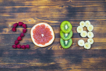 Wall Mural - happy new year 2019 of fruit and berries on wooden background.