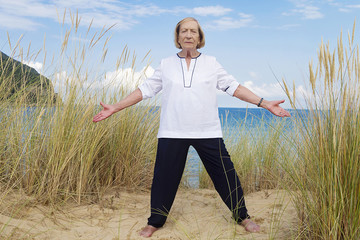 An old woman practicing Tai Chi