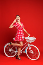 Beautiful Girl In Pin-up Style With A Bicycle