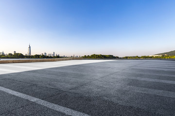 Panoramic skyline and modern business office buildings with empty road,empty concrete square floor