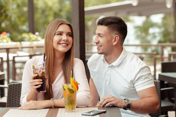 Wall Mural - Two people in cafe enjoying the time spending with each other