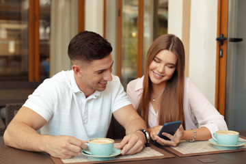 Wall Mural - Two people in cafe enjoying the time spending with each other