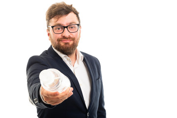 Wall Mural - Portrait of business man handing a bottle of water.
