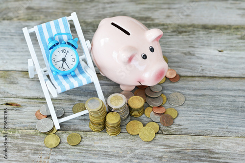 Fotografía Time to invest your savings concept with pile of money , alarm clock and piggy b