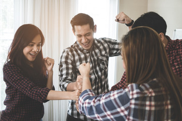 Wall Mural - Team showing team work success winning gesture in business team meeting