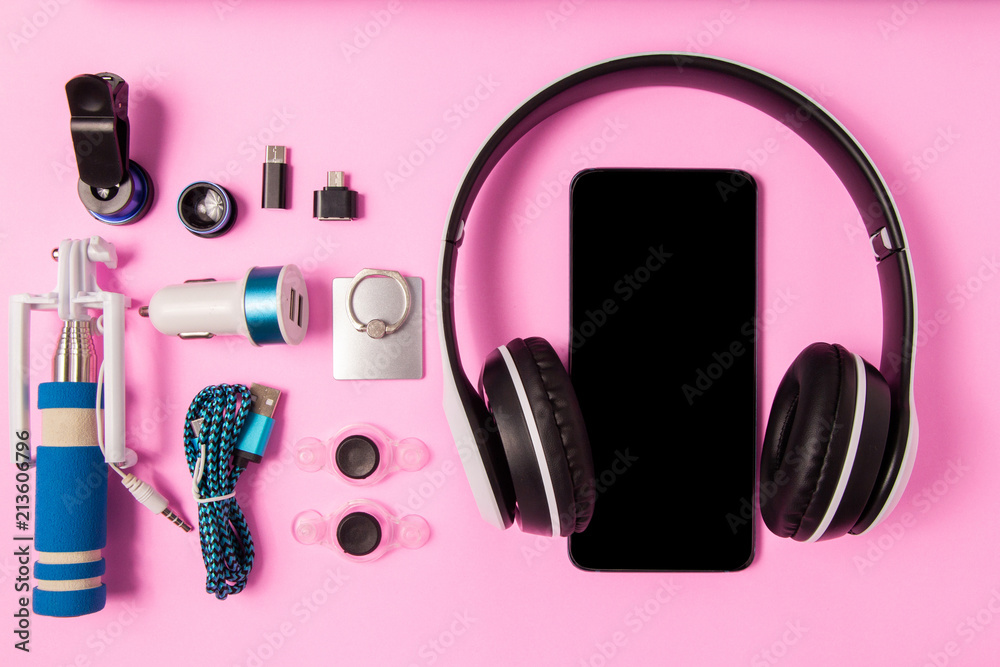 Headset listen music with mobile phone and Accessory set technology Blank space on bright pink background - obrazy, fototapety, plakaty 