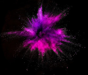 Wall Mural - Colored powder explosion on black background.